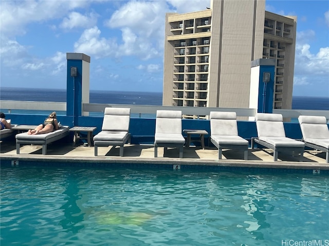 view of pool featuring a water view