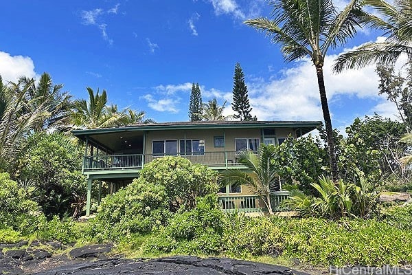 view of front of home with a balcony