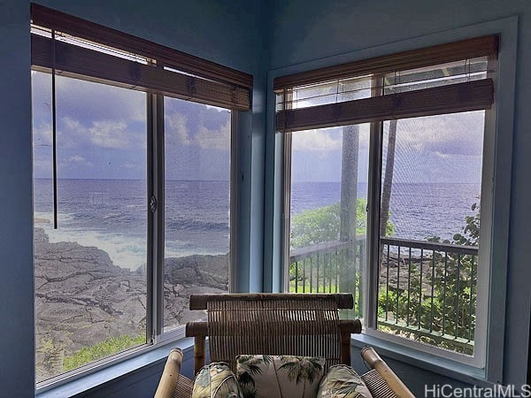 sunroom with a water view