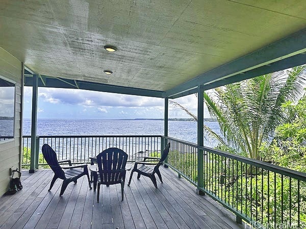 wooden deck with a water view