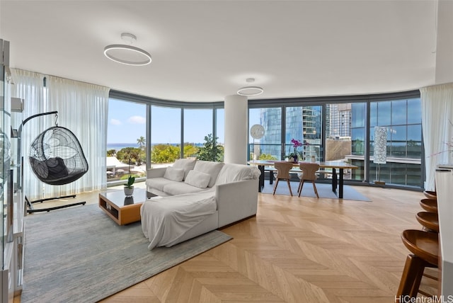 living room featuring light parquet flooring and floor to ceiling windows