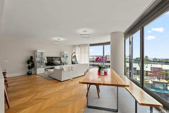 living area featuring baseboards