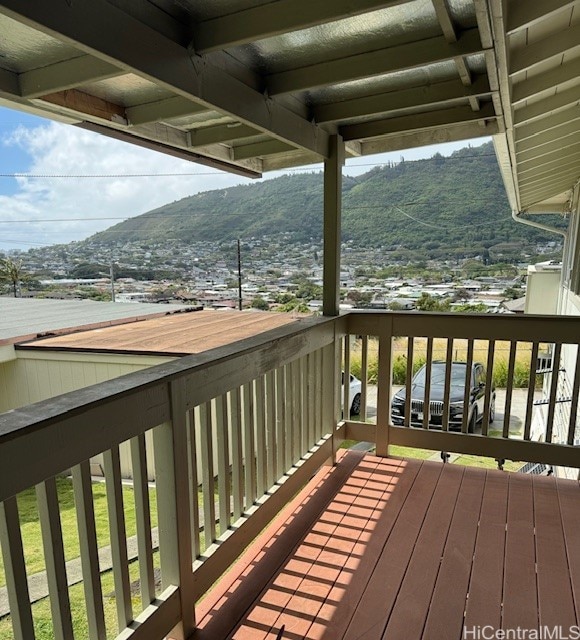 wooden deck with a mountain view