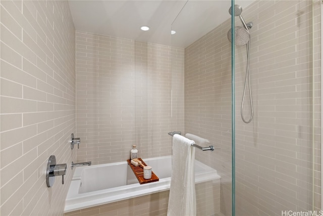 bathroom with separate shower and tub