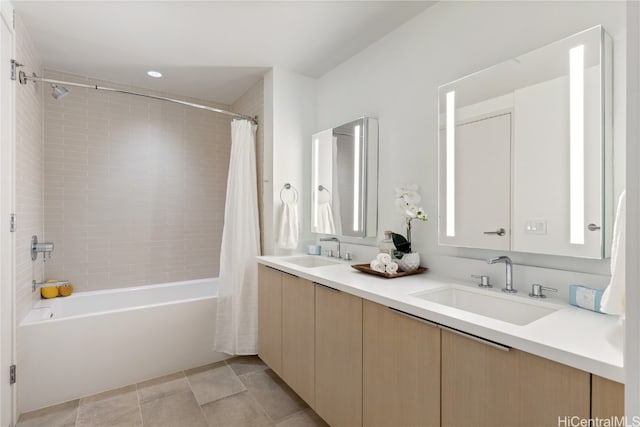 bathroom featuring tile patterned flooring, vanity, and shower / tub combo