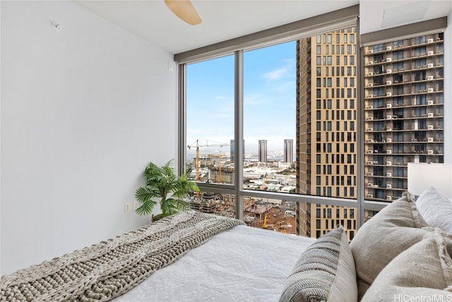 bedroom featuring floor to ceiling windows