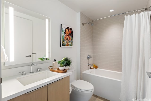 full bathroom featuring toilet, tile patterned floors, vanity, and shower / tub combo with curtain