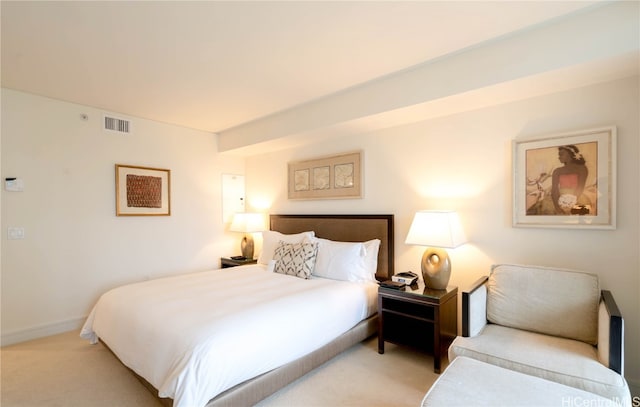 bedroom with light colored carpet