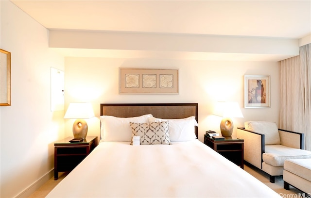 bedroom featuring light colored carpet