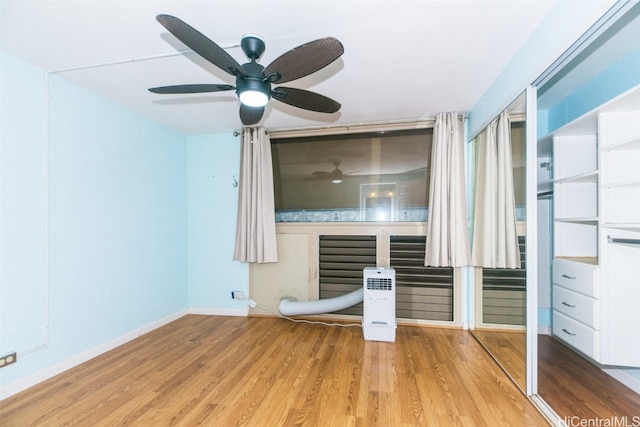 unfurnished bedroom with light hardwood / wood-style floors and ceiling fan