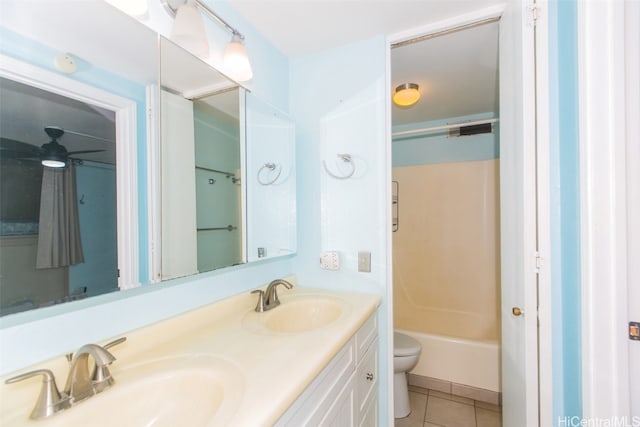 full bathroom with tile patterned floors, toilet, shower / bathtub combination, vanity, and ceiling fan