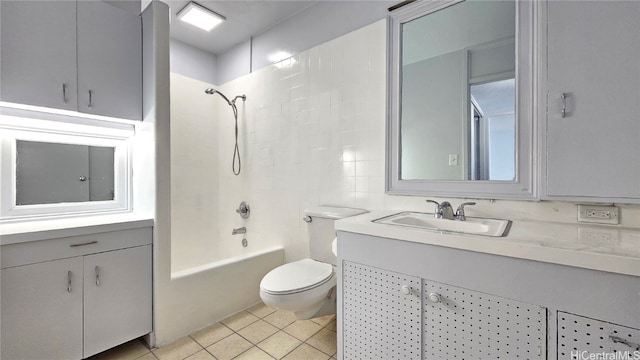 full bathroom featuring tasteful backsplash, toilet, tile patterned floors, shower / tub combination, and vanity