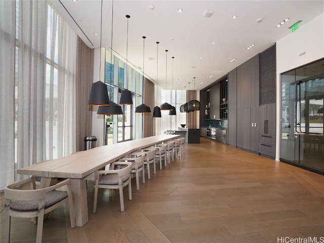 dining space with light hardwood / wood-style flooring