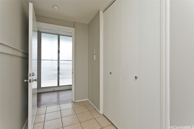 hallway with light tile patterned floors