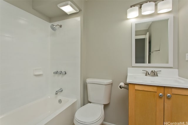 full bathroom with vanity, toilet, and tiled shower / bath