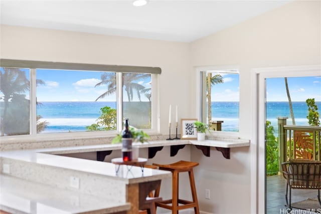 dining room featuring a water view