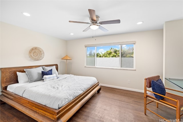 bedroom with hardwood / wood-style floors and ceiling fan