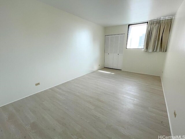 empty room with light hardwood / wood-style floors