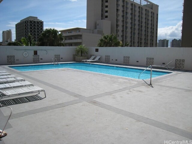 view of swimming pool with a patio