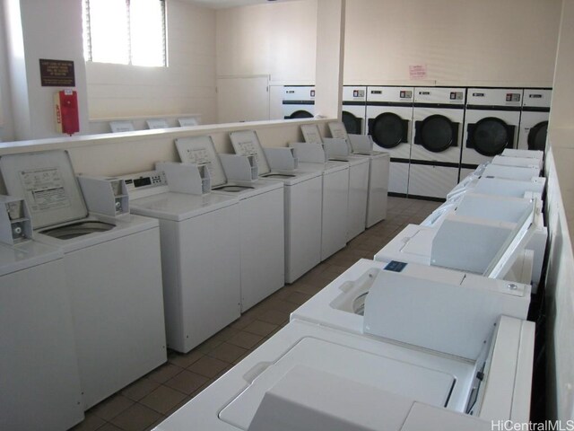 washroom featuring separate washer and dryer and light tile patterned floors