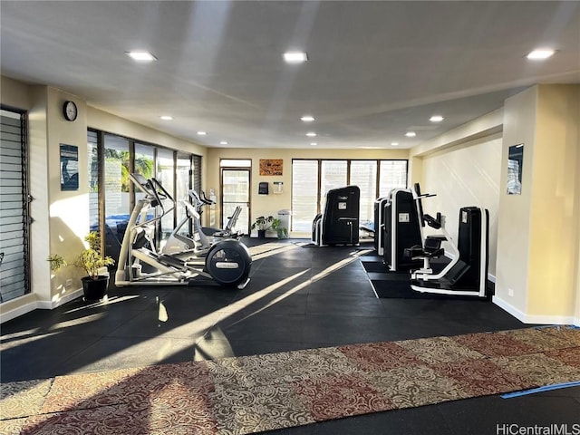 workout area featuring recessed lighting and baseboards