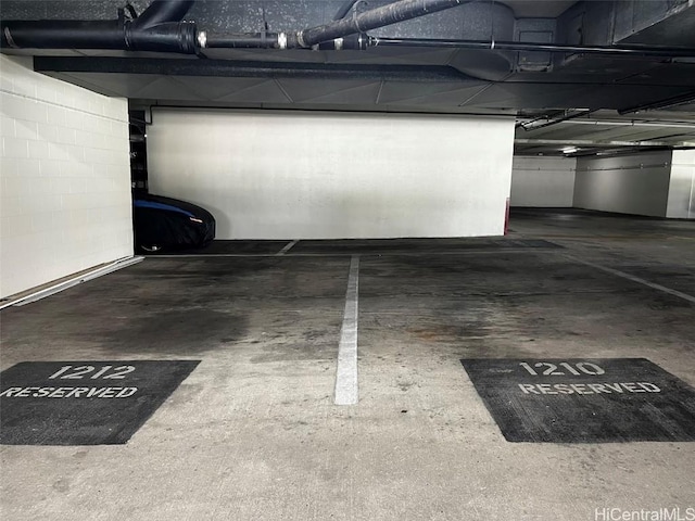 parking deck featuring concrete block wall