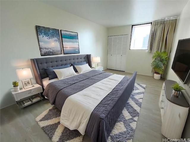 bedroom with light wood finished floors