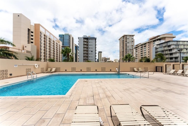 view of swimming pool with a patio area