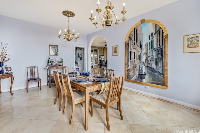 dining area with an inviting chandelier and vaulted ceiling