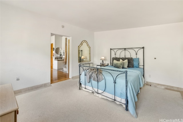 bedroom featuring light colored carpet