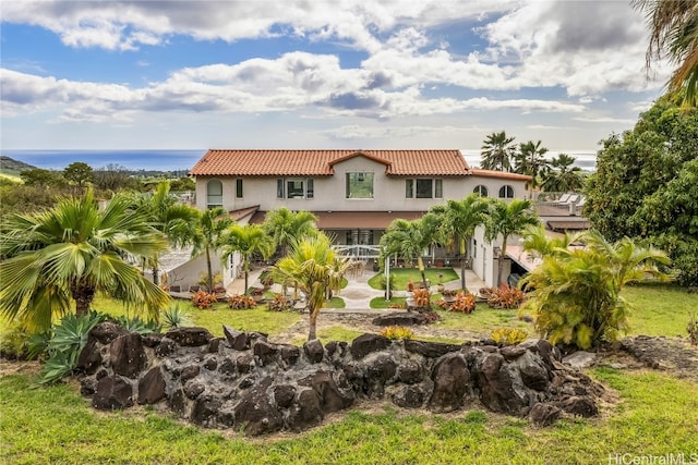 exterior space featuring a water view and a patio