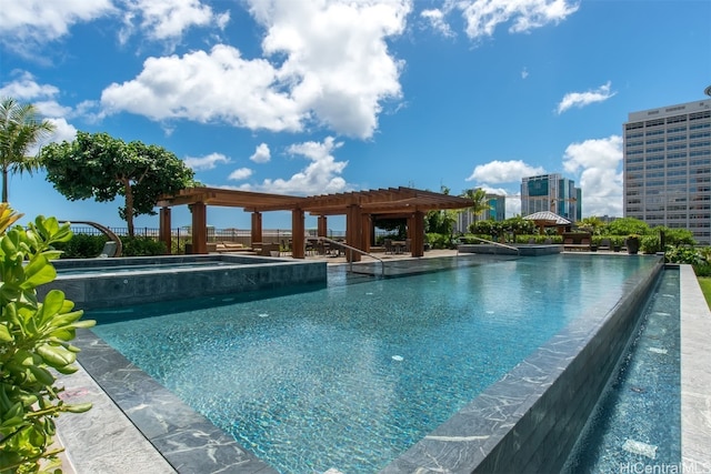 view of swimming pool featuring an in ground hot tub