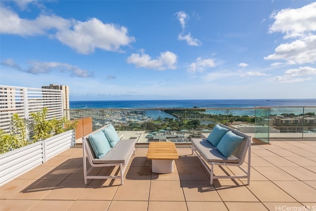 view of patio featuring an outdoor living space and a water view