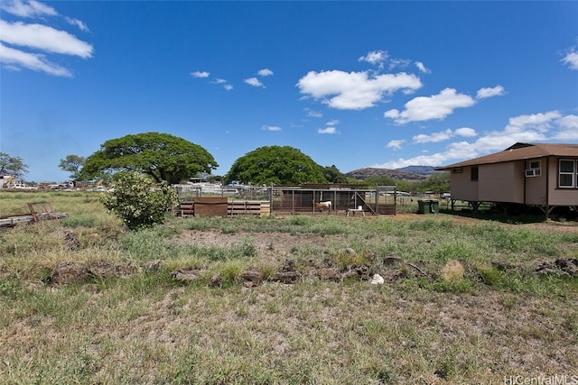 view of yard featuring a mountain view and a rural view