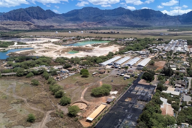 birds eye view of property featuring a water and mountain view