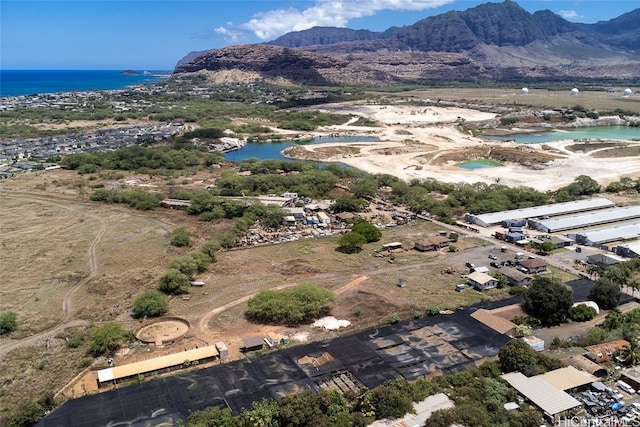 bird's eye view with a water and mountain view