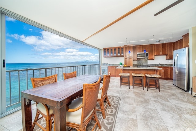 dining space with a water view