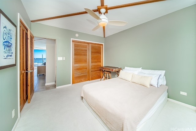 carpeted bedroom featuring a closet and ceiling fan