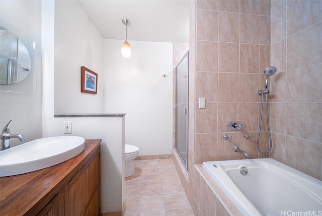 full bathroom featuring vanity, toilet, tile patterned floors, and independent shower and bath