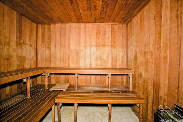 view of sauna with wood ceiling and wood walls