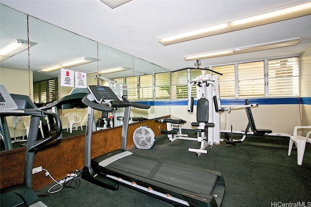 gym with a textured ceiling