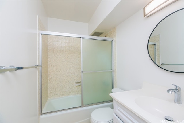 full bathroom with toilet, combined bath / shower with glass door, and vanity