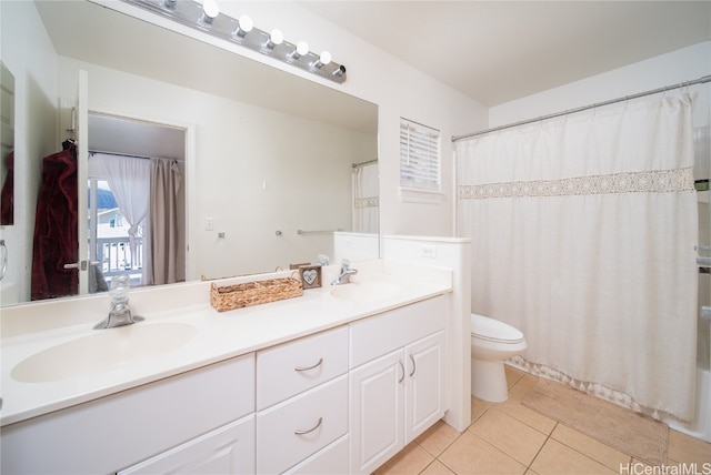 bathroom featuring vanity, toilet, and tile patterned floors