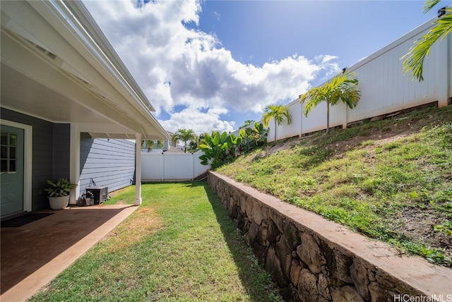 view of yard featuring a patio area and central AC