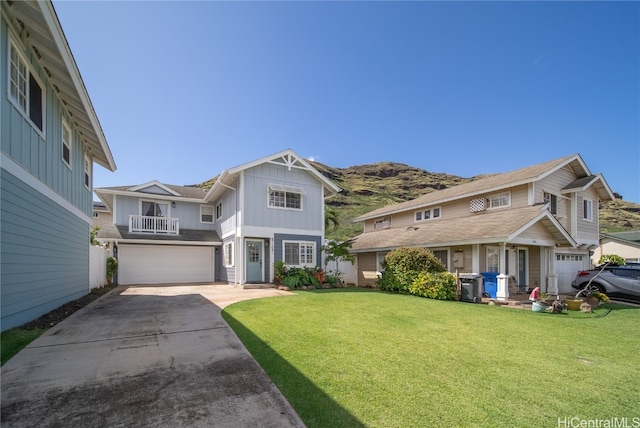 view of front of home with a front lawn and a garage