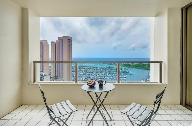 balcony featuring a water view