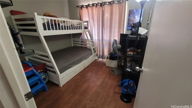 bedroom featuring dark hardwood / wood-style flooring