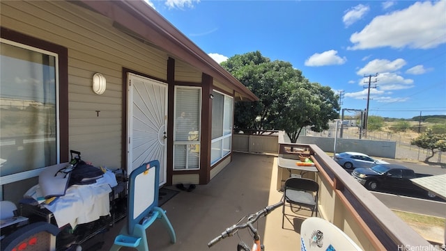 view of patio featuring a balcony