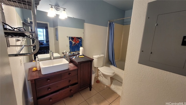 full bathroom featuring electric panel, shower / bath combination with curtain, toilet, vanity, and tile patterned flooring