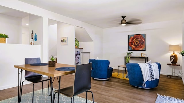 dining area featuring hardwood / wood-style floors and ceiling fan